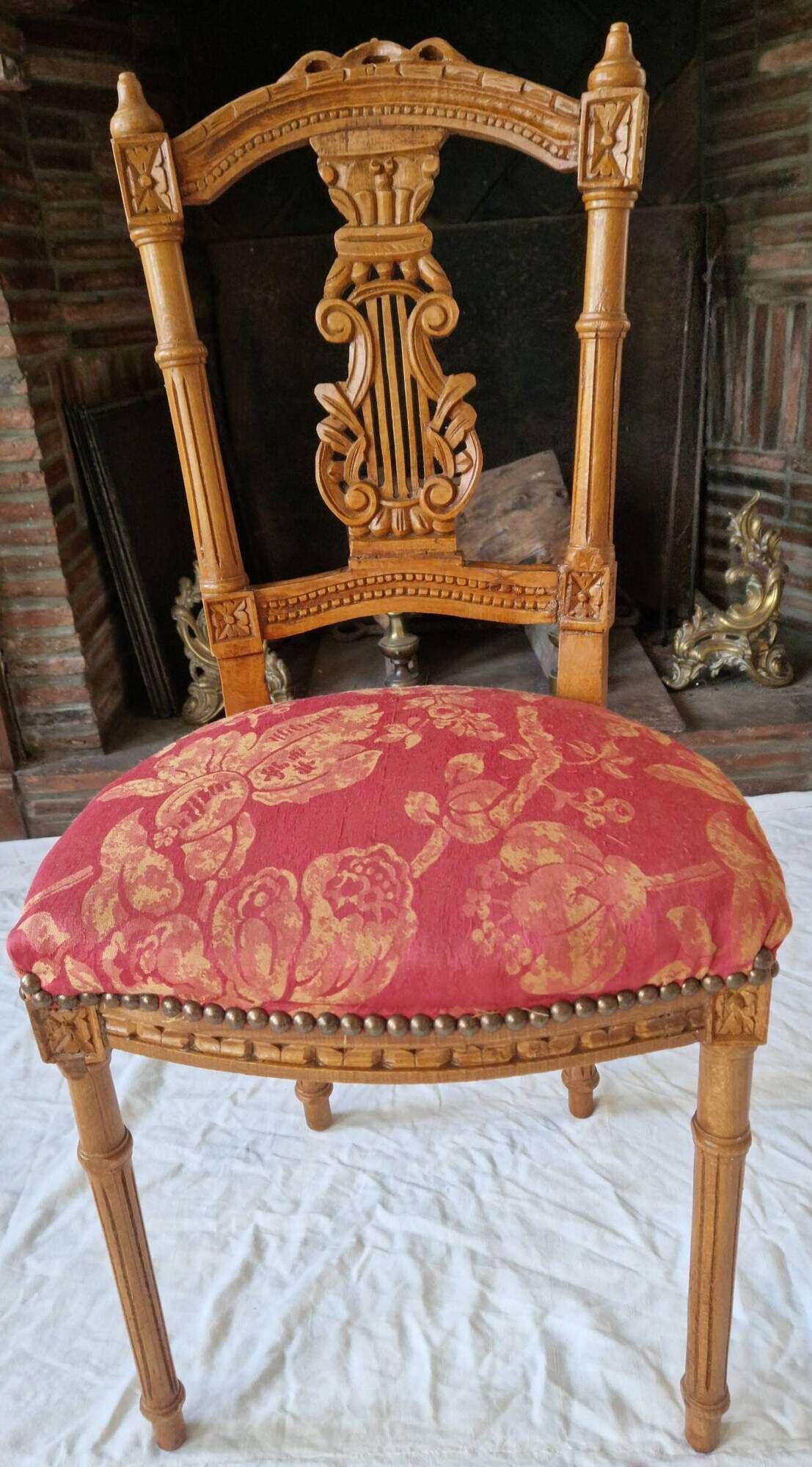 Lyre back chair in carved wood, Louis XVI style, late 19th century.