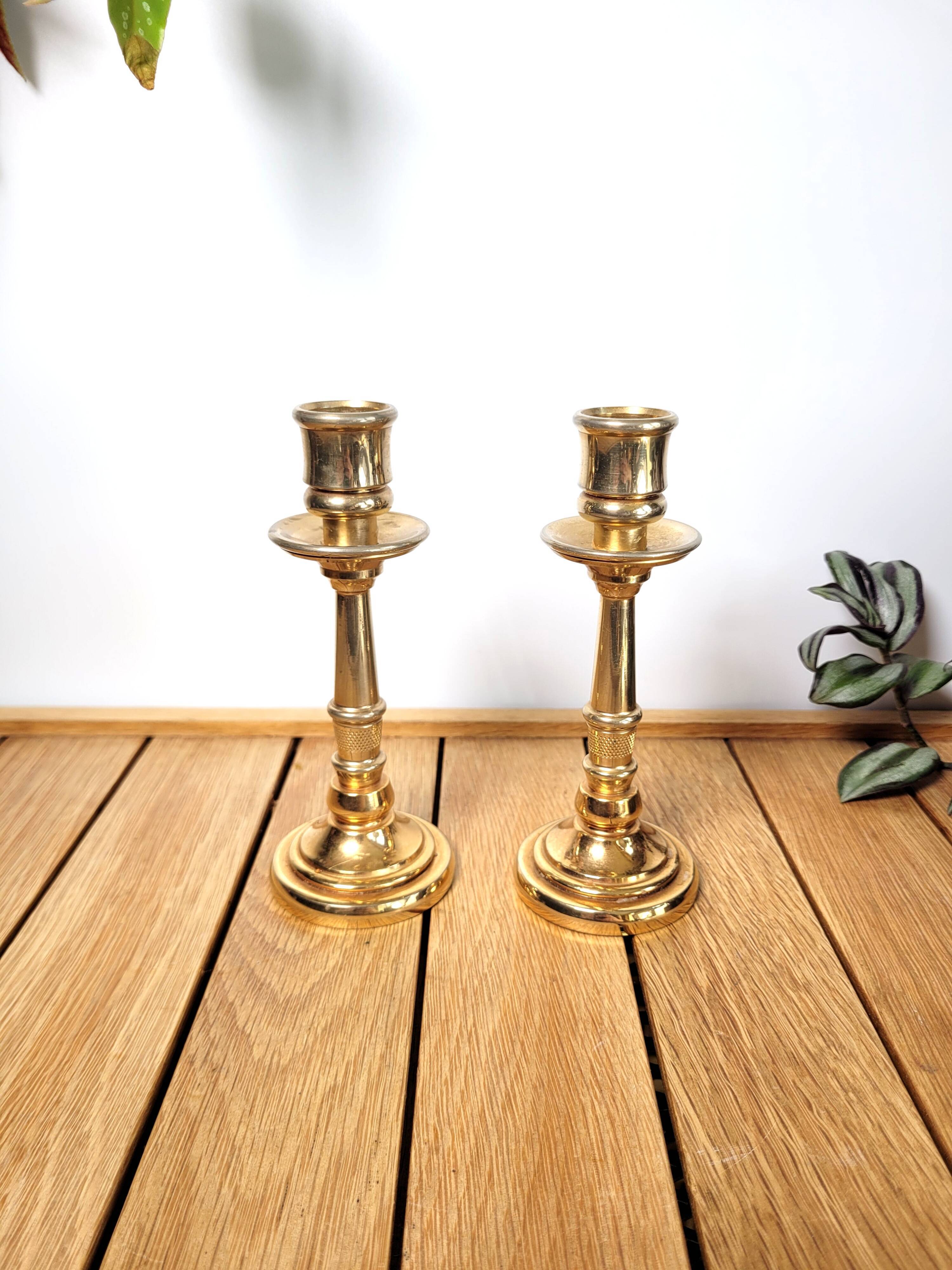 Pair of candle holders in solid gilded metal
