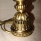bronze bedside lamp with a pink cracked glass shade