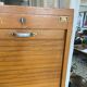 1950s oak office storage cabinet with curtains.
