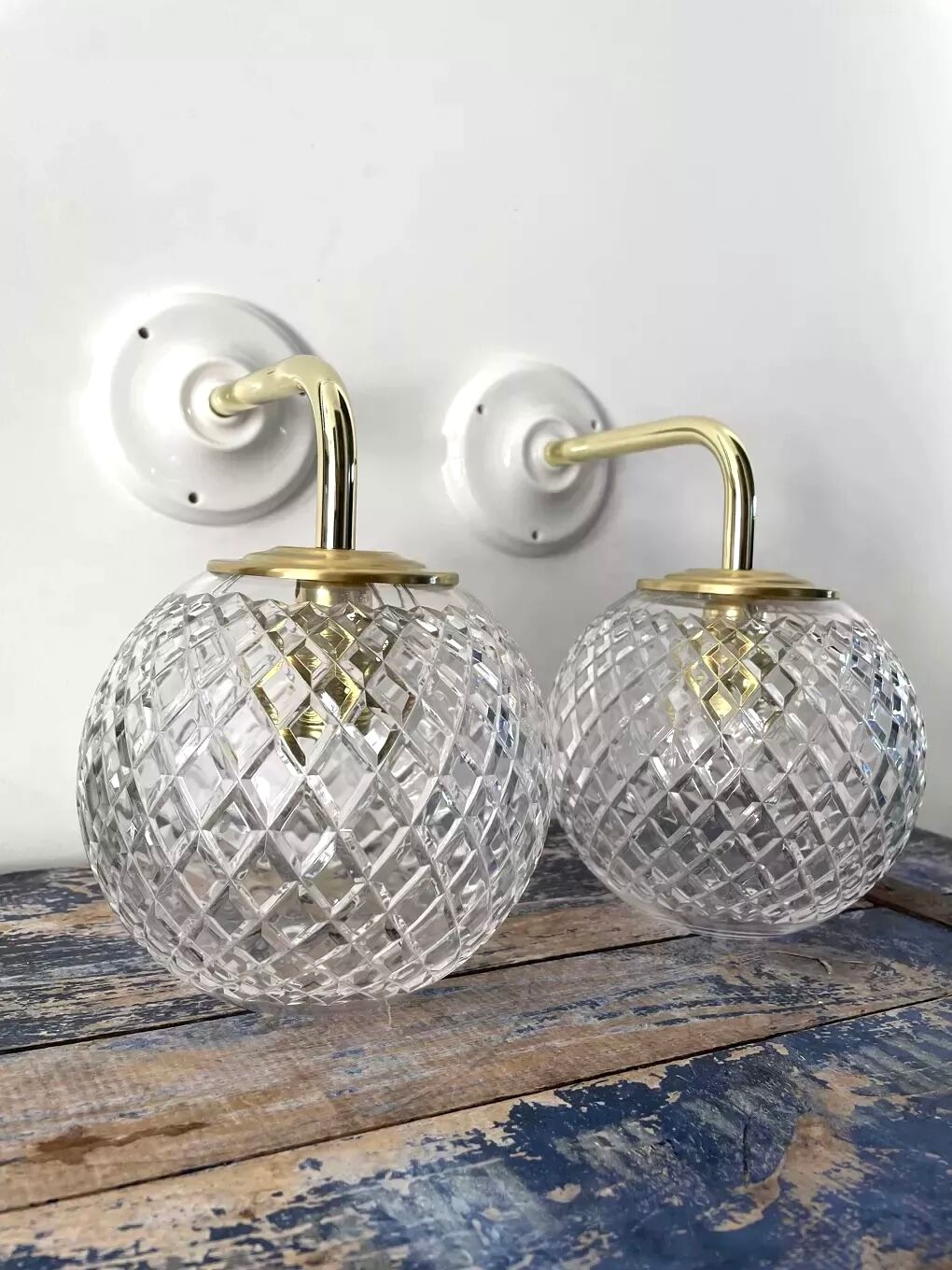 Pair of brass and glass wall sconces