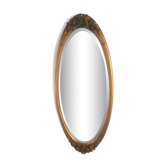 Miroir ovale biseauté art déco en stuc doré