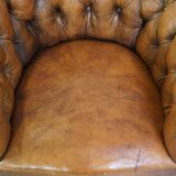 Fauteuil chesterfield sur roulettes en cuir de mouton