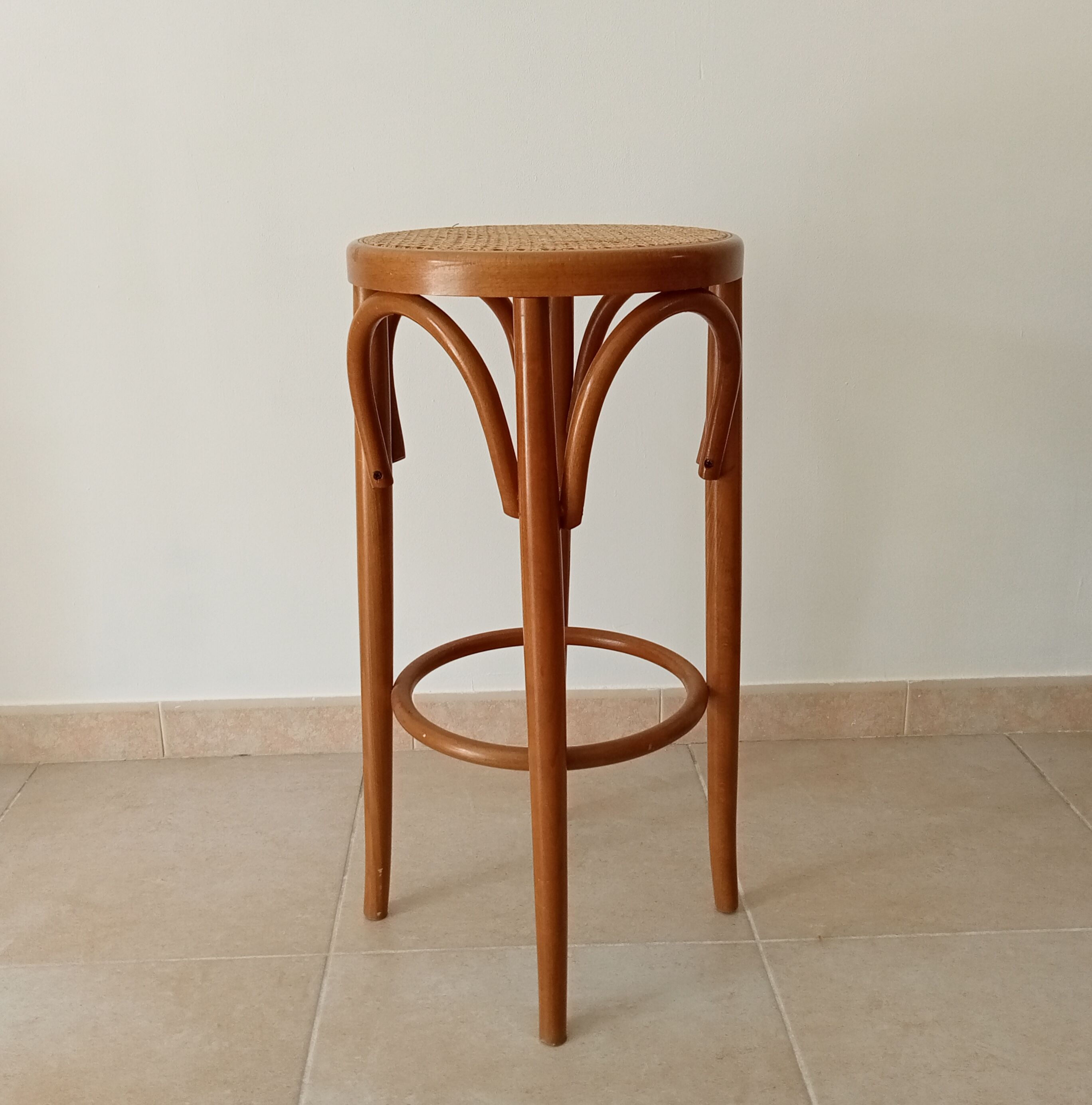 Vintage curved wooden high stool and tanned seat