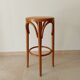 Vintage curved wooden high stool and tanned seat