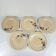 Set de 5 assiettes plates Sarreguemines motif floral, 1920-40