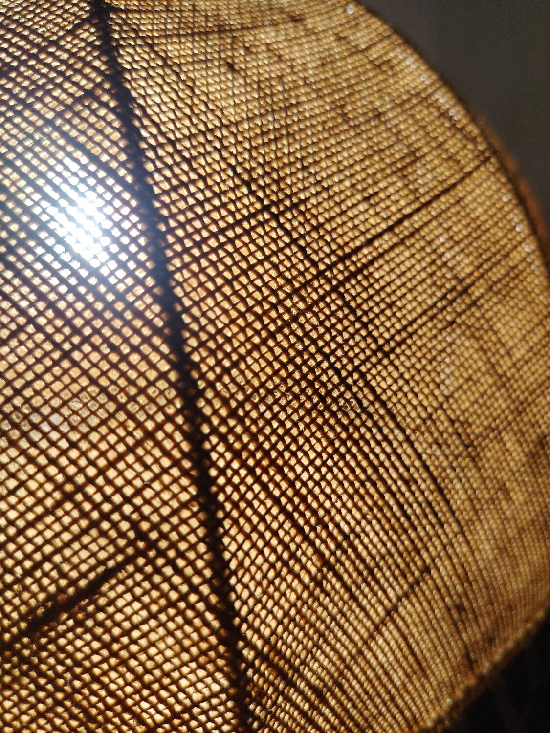 Large hanging pendant light with a burlap and pom-pom style