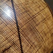 Large hanging pendant light with a burlap and pom-pom style