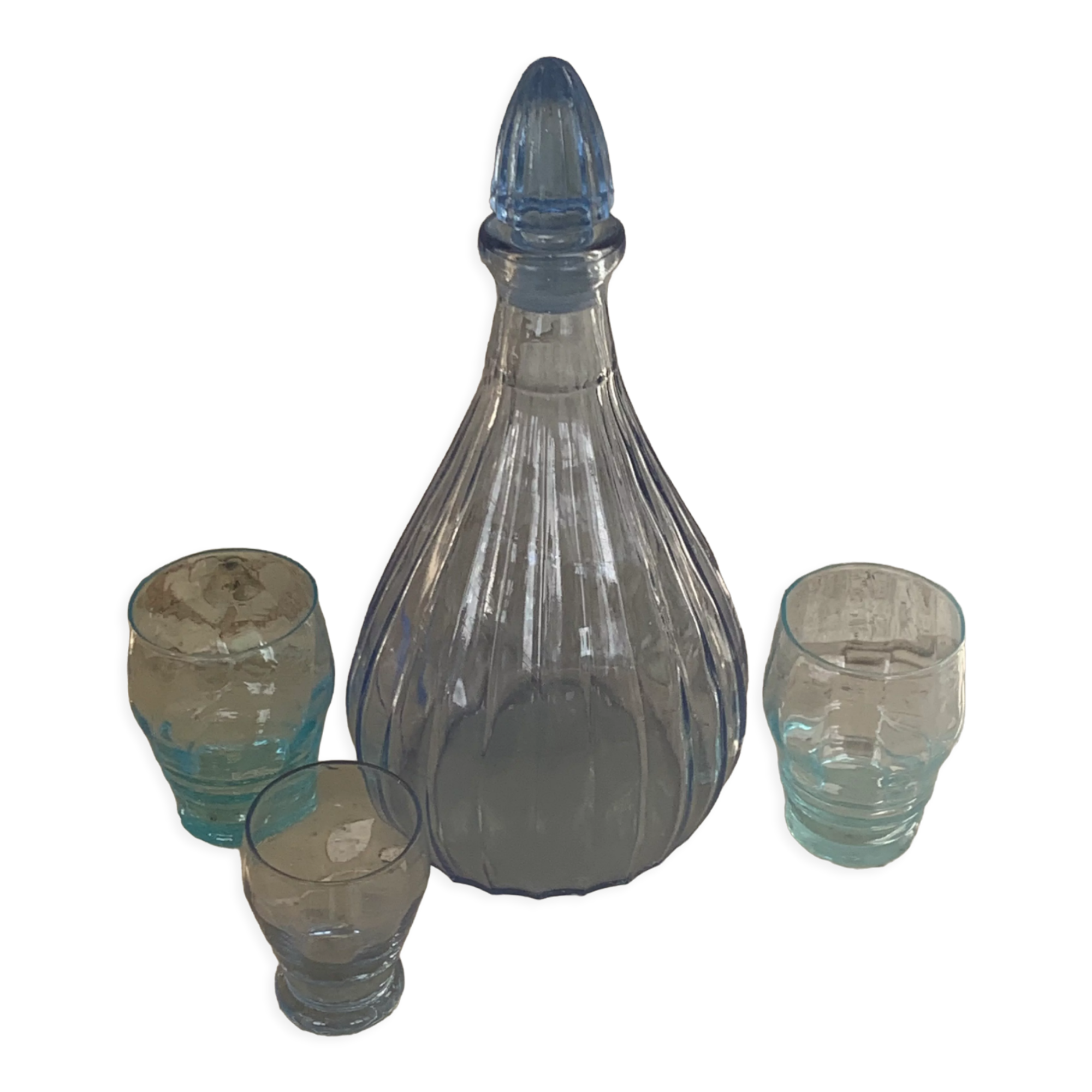 Liquor service consisting of a blue glass decanter and. 3 small antique glasses
