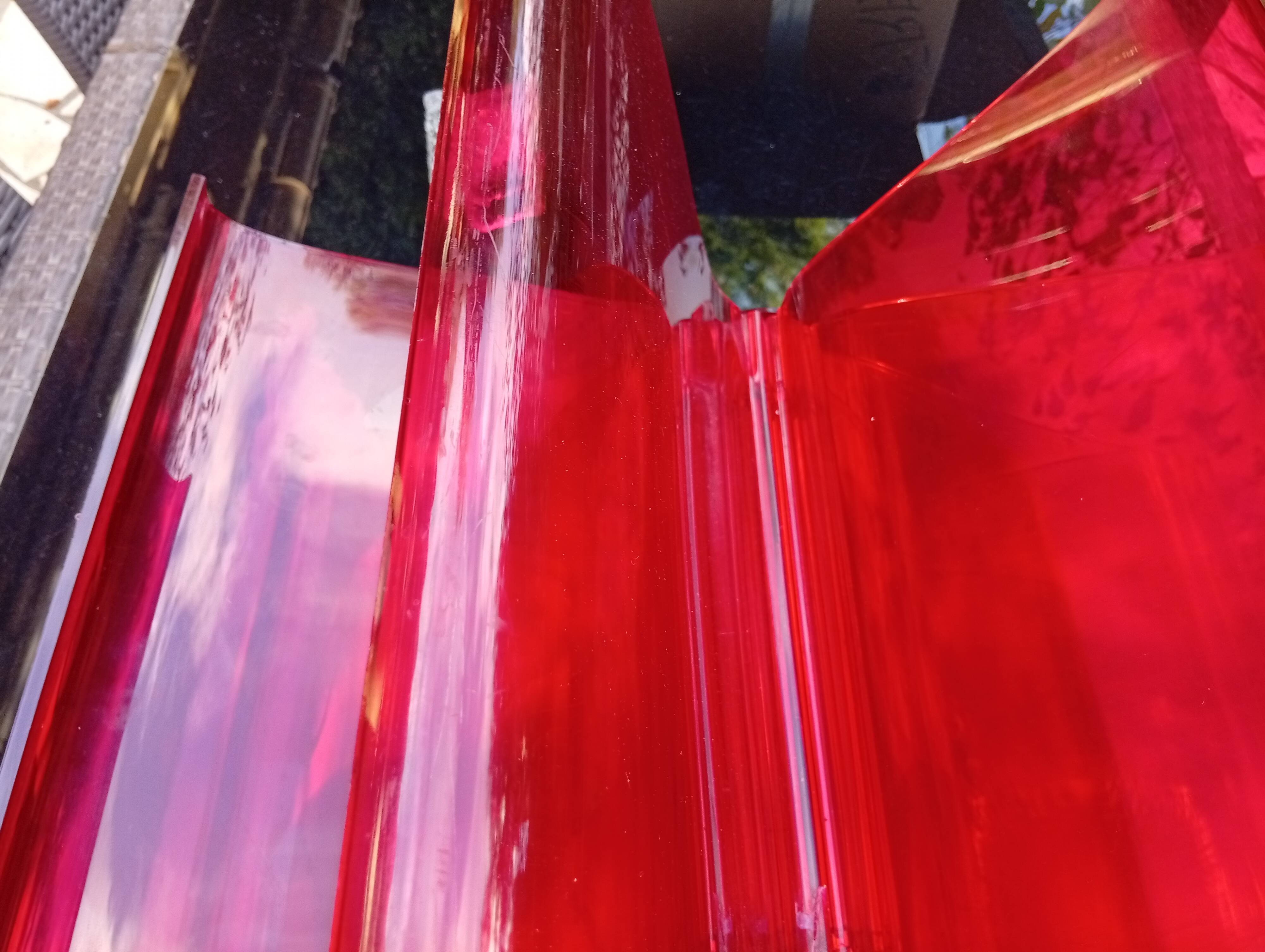 Kartell red magazine rack