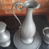 2 pitchers and 1 pewter pitcher