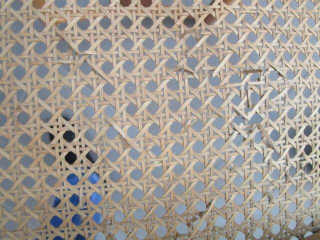 Pair of old caned chairs in blond wood