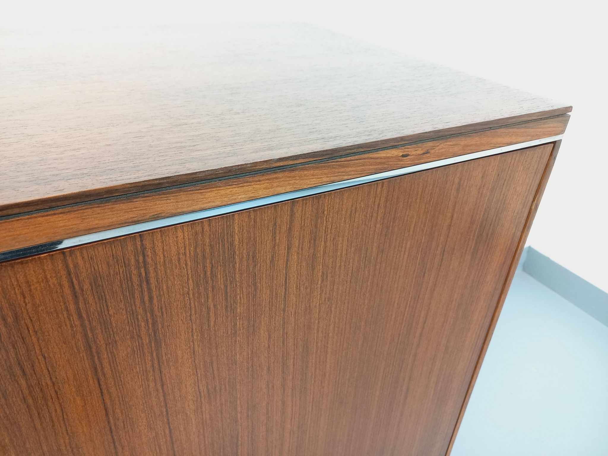 Vintage modernist enfilade in rosewood and chrome metal from the 60s and 70s.