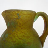Pitcher in orange and green marble glass paste. Signed Georges De Feure for Daum