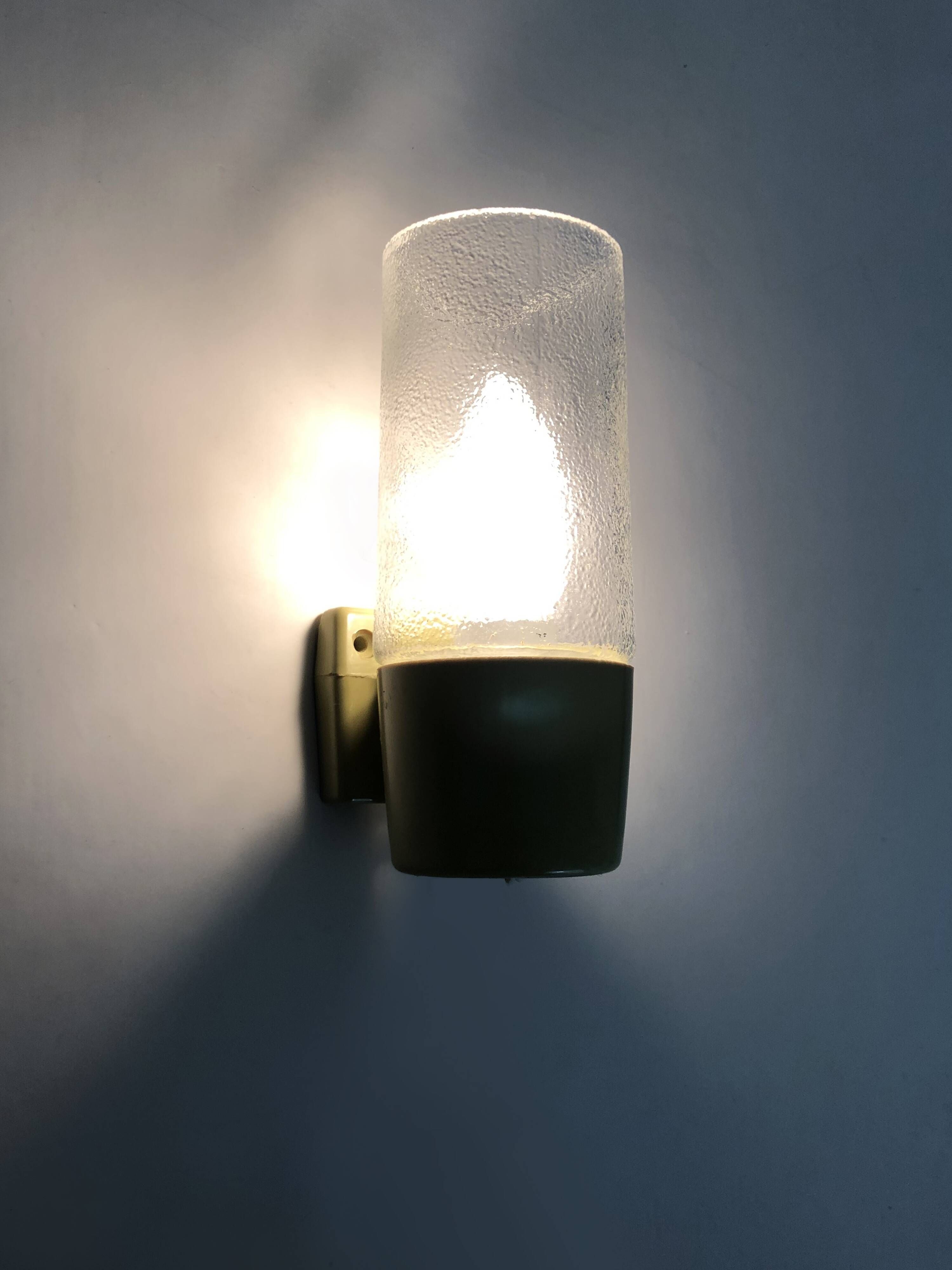 Pair of vintage pop wall lights in pastel green PVC and glass globe. 70s
