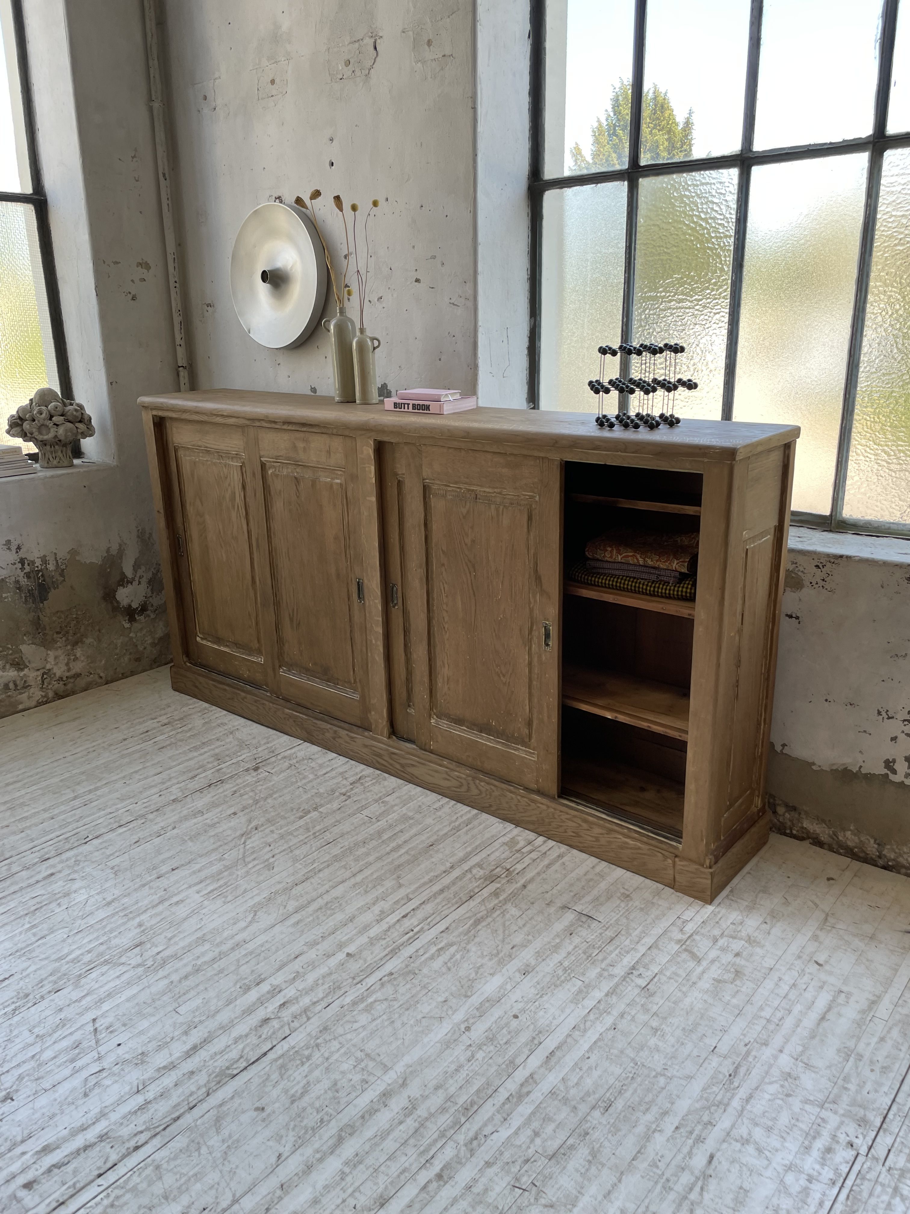 Large row of solid oak loom sliding doors