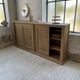 Large row of solid oak loom sliding doors