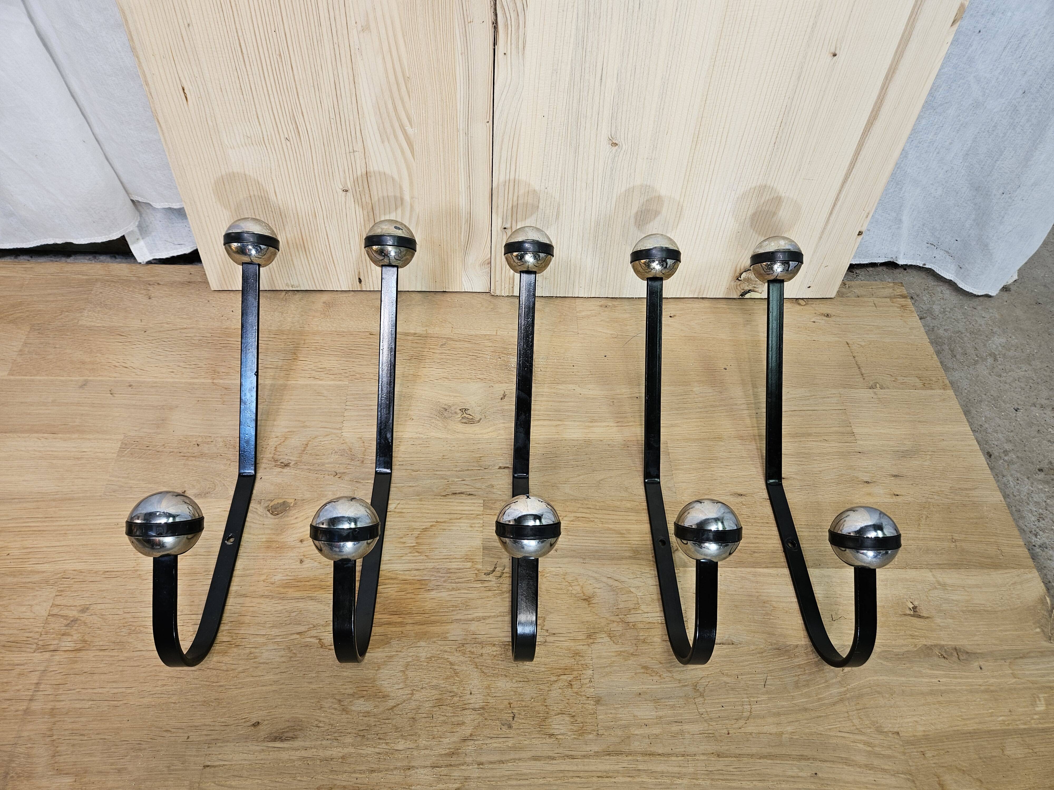 5 black and silver coat hooks from the 60s