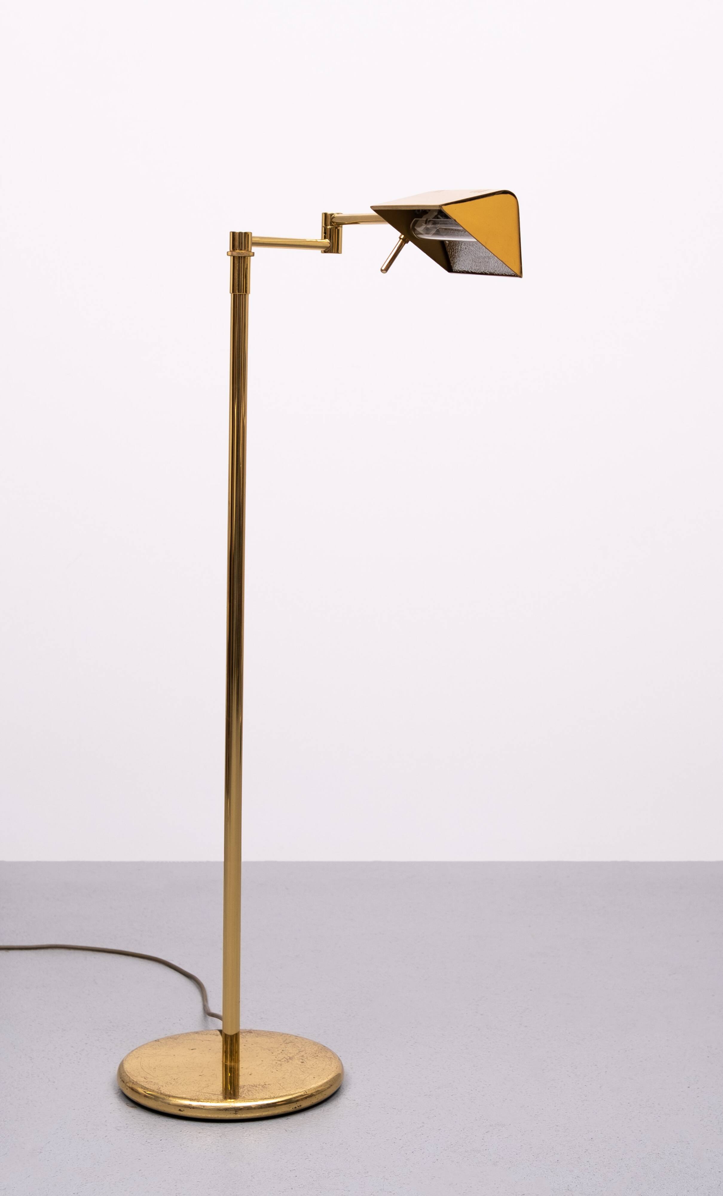 Holtkoetter adjustable Brass swing arm floor lamp. Germany