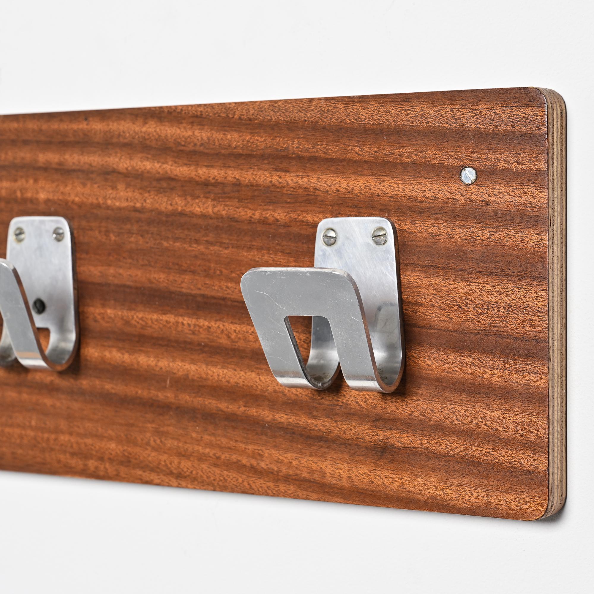 Wall coat rack and lights by Pierre Guariche for La Plagne, around 1968.