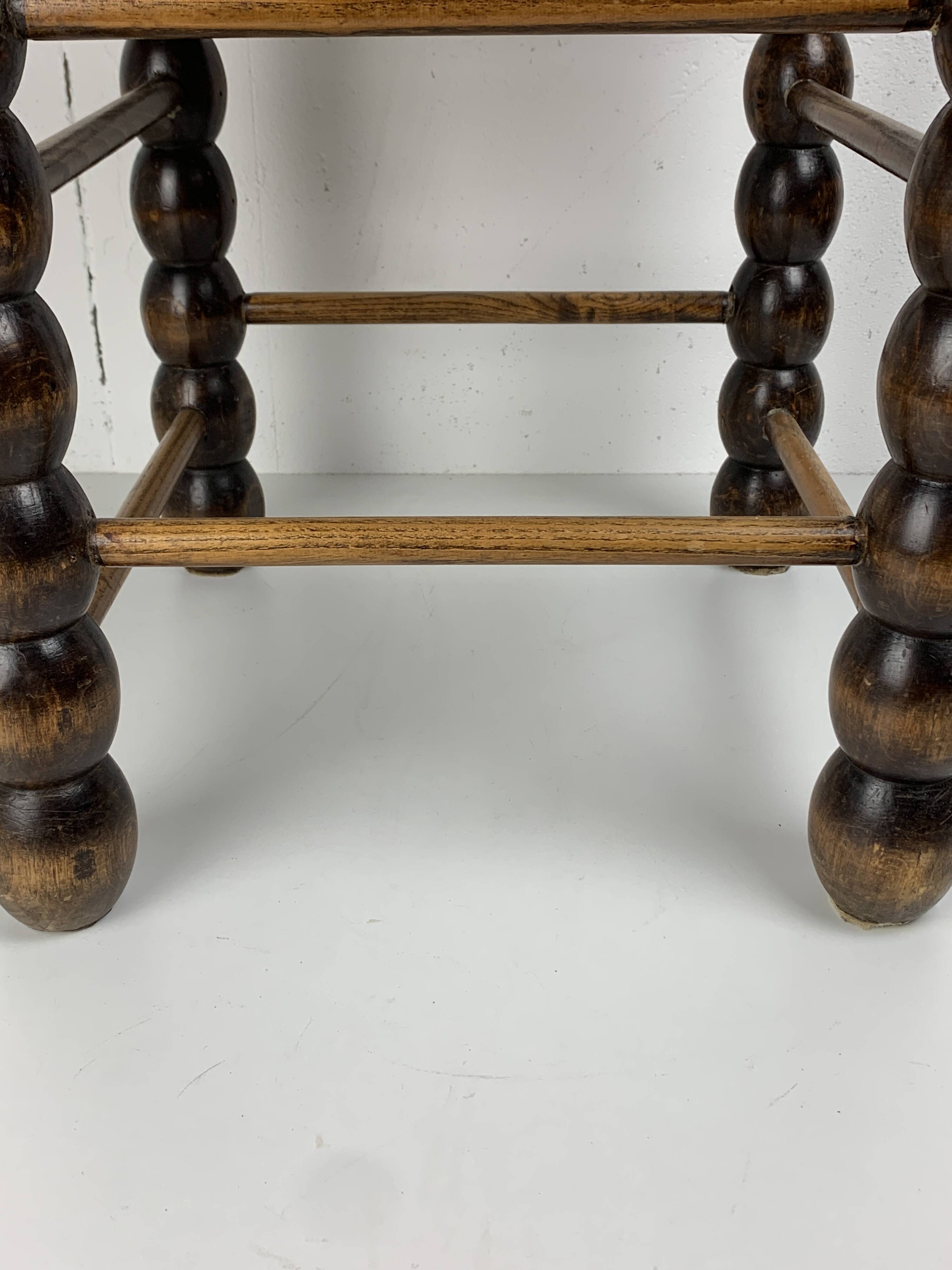 Brutalist wood turned bobbin rush stool in the style of Charles Dudouyt
