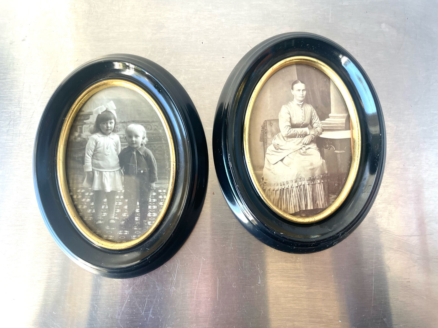 Pair of black wooden oval frames 1880’s  each 13 cm x 10 cm glass measurements 8.5 cm x 5.5 cm