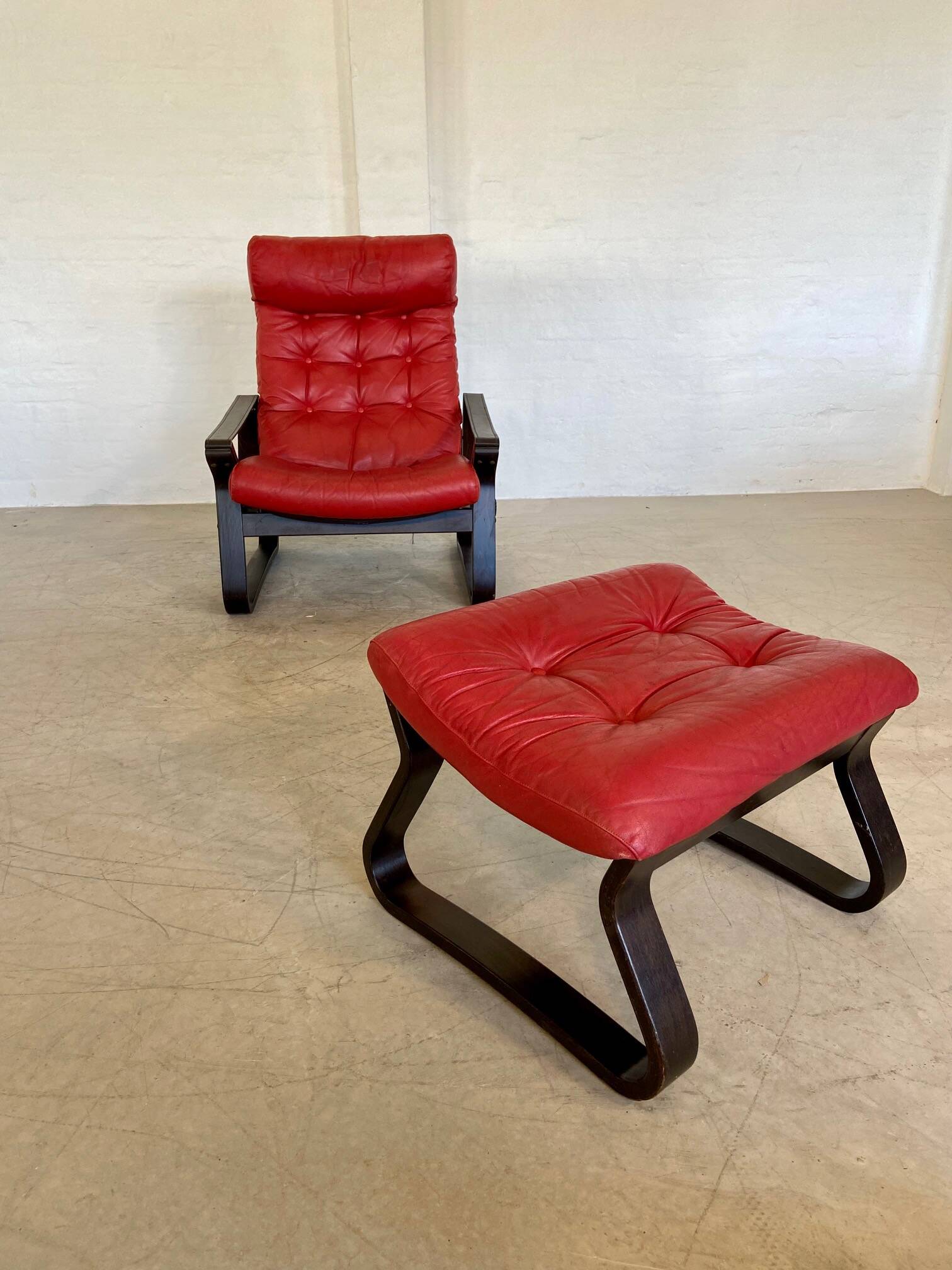 Vintage danish retro reclining lounge chair & stool in red leather by komfo