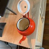 Vintage red enamelled sheet metal teapot