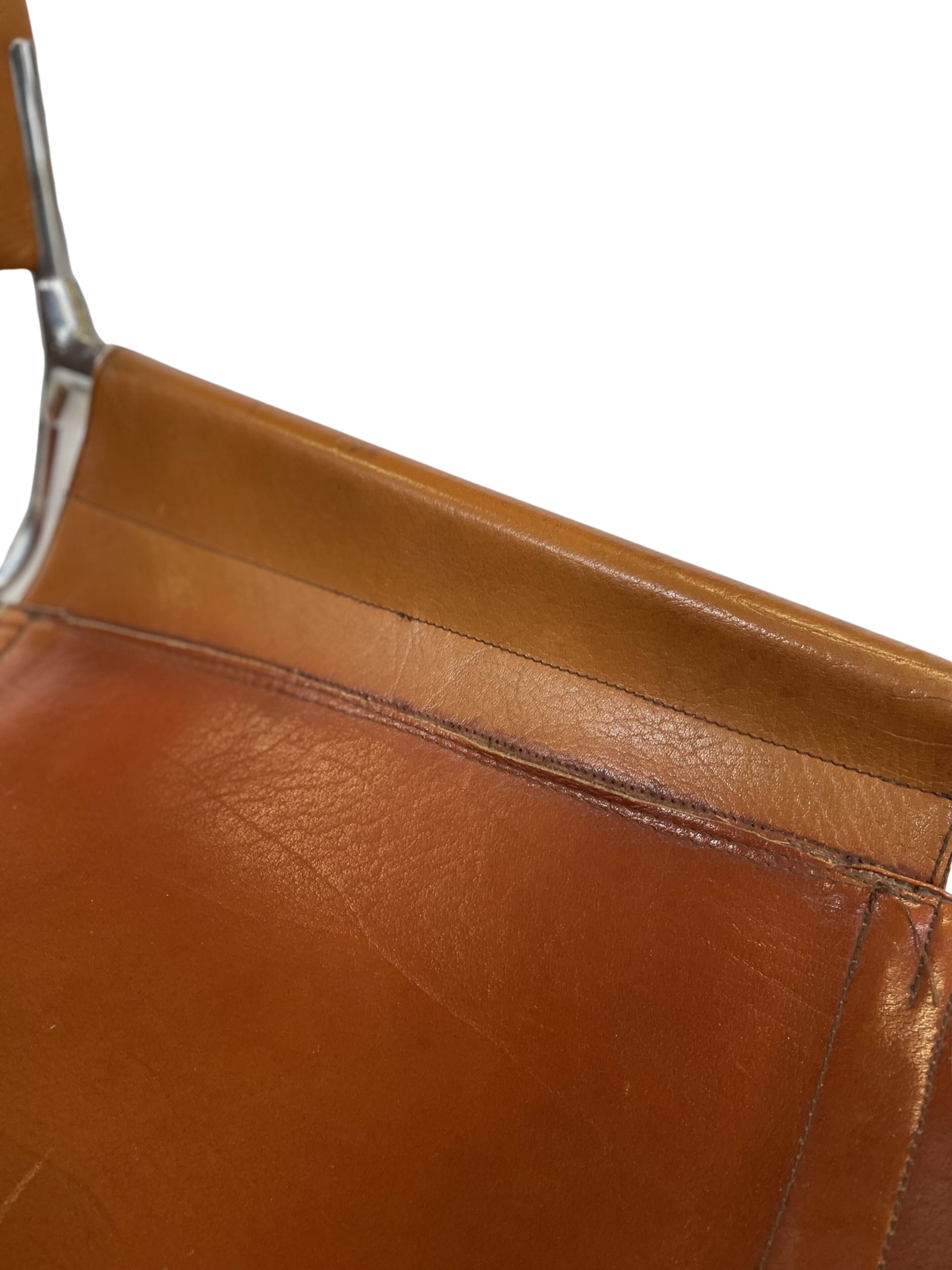 vintage dining room chair in cognac leather and chrome 1970s Italy