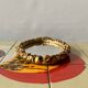 Small vintage oval wall mirror in varnished gold resin