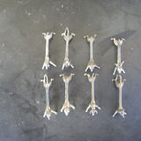 Series of eight antique knife holders in silver metal.