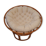 Rattan swivel chair and linen cushion
