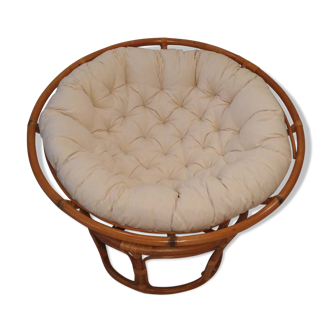 Rattan swivel chair and linen cushion