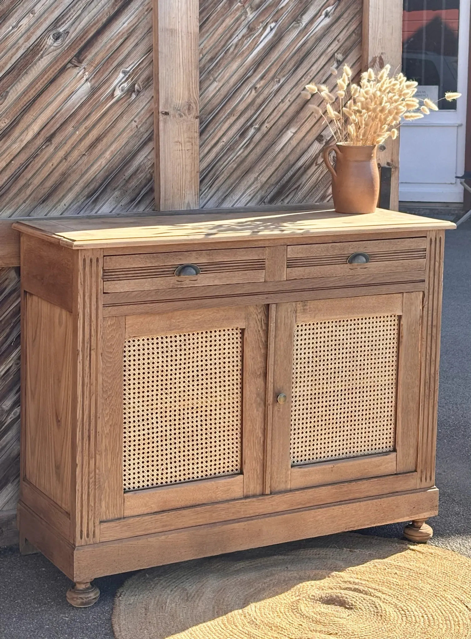 Old buffet in raw solid oak and cane.
