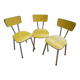 3 canary yellow formica chairs