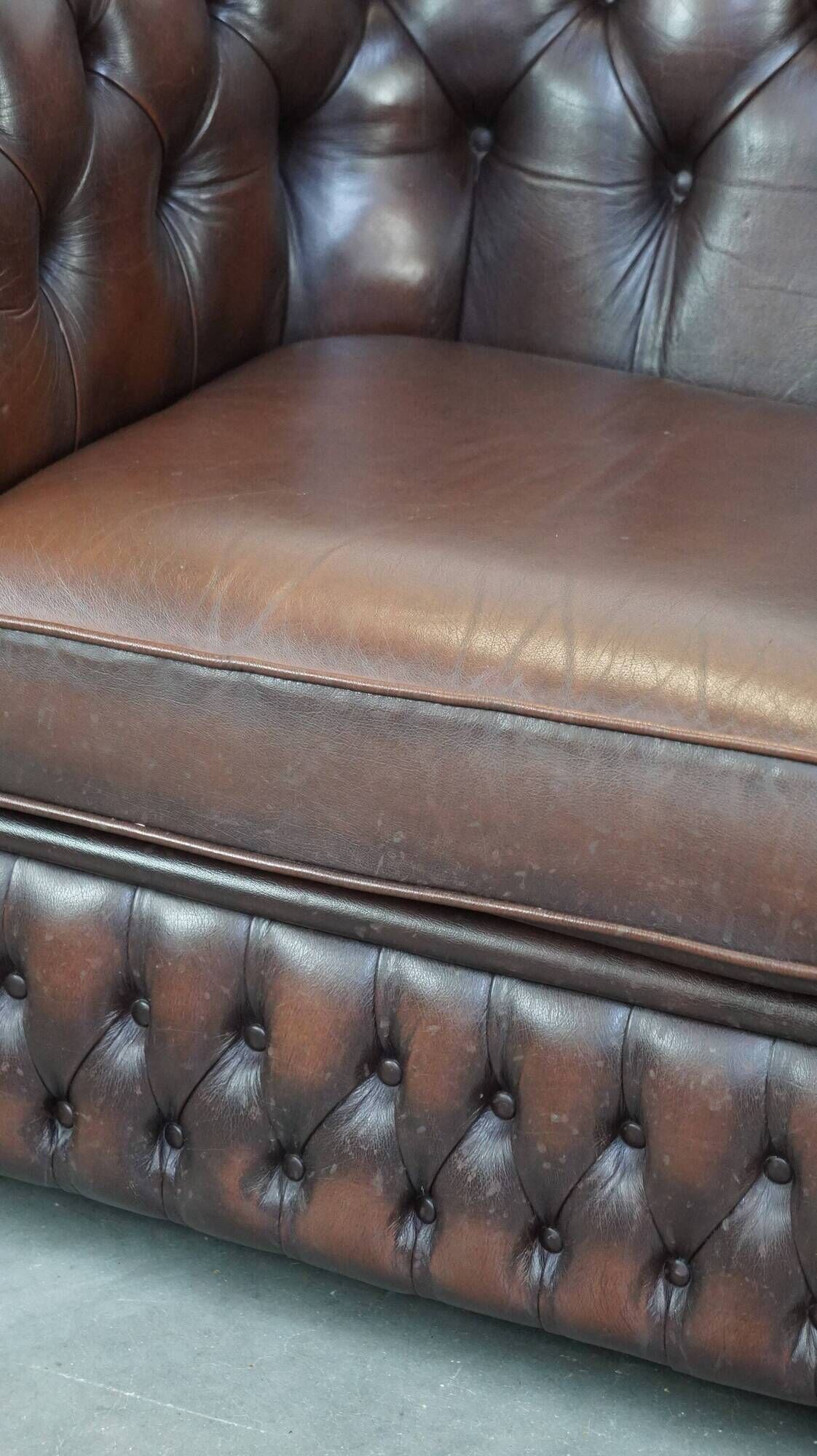 Beautiful and spacious dark brown mottled English cow leather Chesterfield armchair