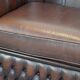 Beautiful and spacious dark brown mottled English cow leather Chesterfield armchair