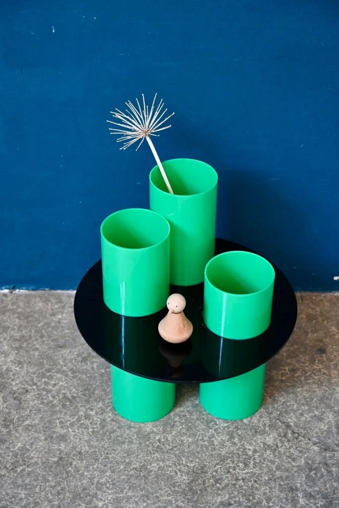 Green plexiglass coffee table in Memphis design style from the 1980s.