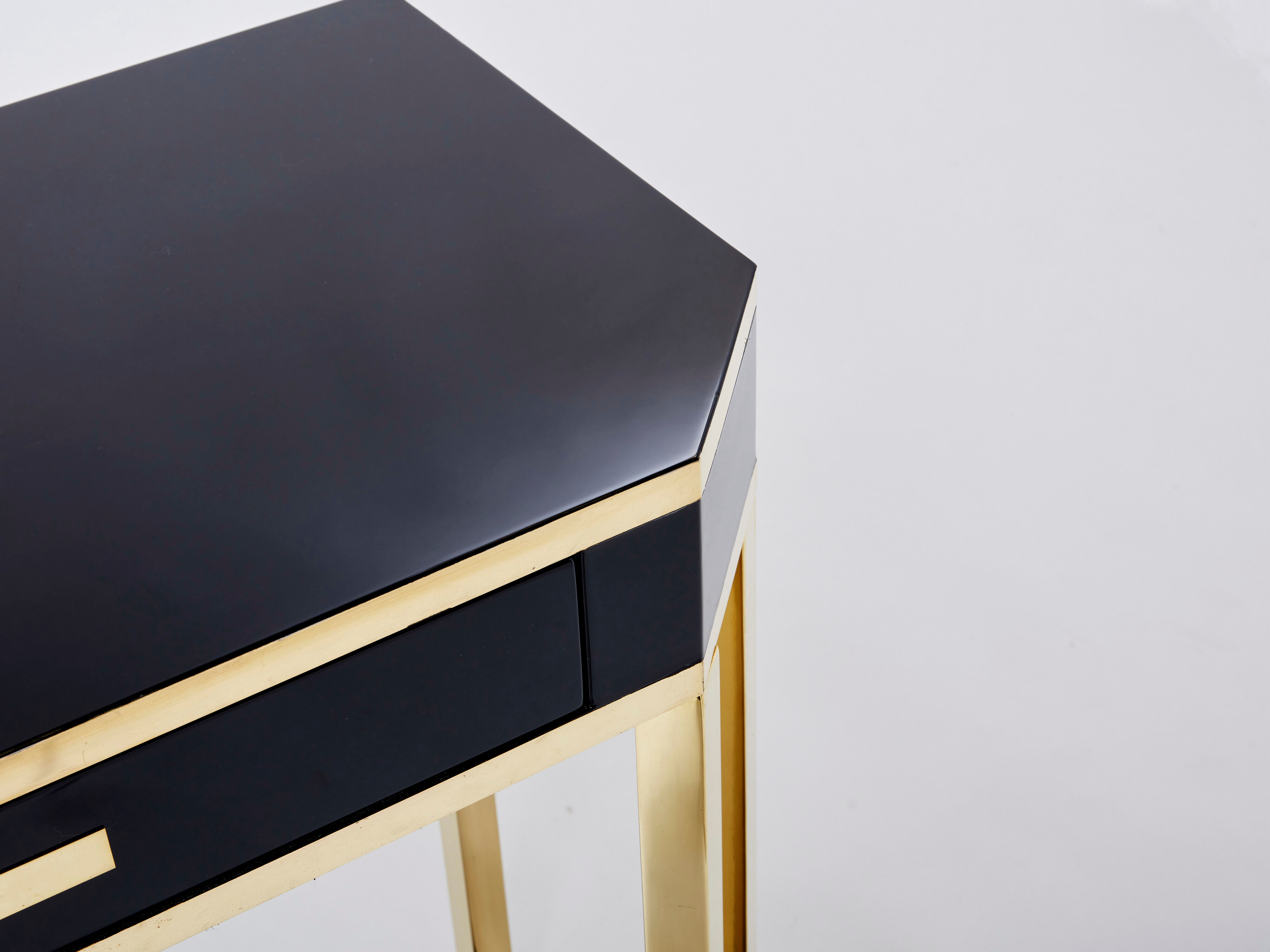 Pair of black lacquered consoles and brass 1970