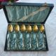 6 spoonfuls of silver and gold metal coffee