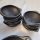 Black terracotta dinnerware set from La Chamba in Colombia. Set of 13 pieces.