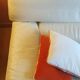Two-seater convertible sofa bed in off-white leather by Ligne Roset.