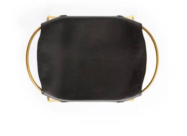Pair of backless stools, black with brass trim.