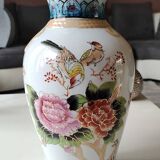 Chinese polychrome porcelain base. Peacock/birds of paradise designs. Corolla-shaped collar with ribbon. 30 x 15 cm