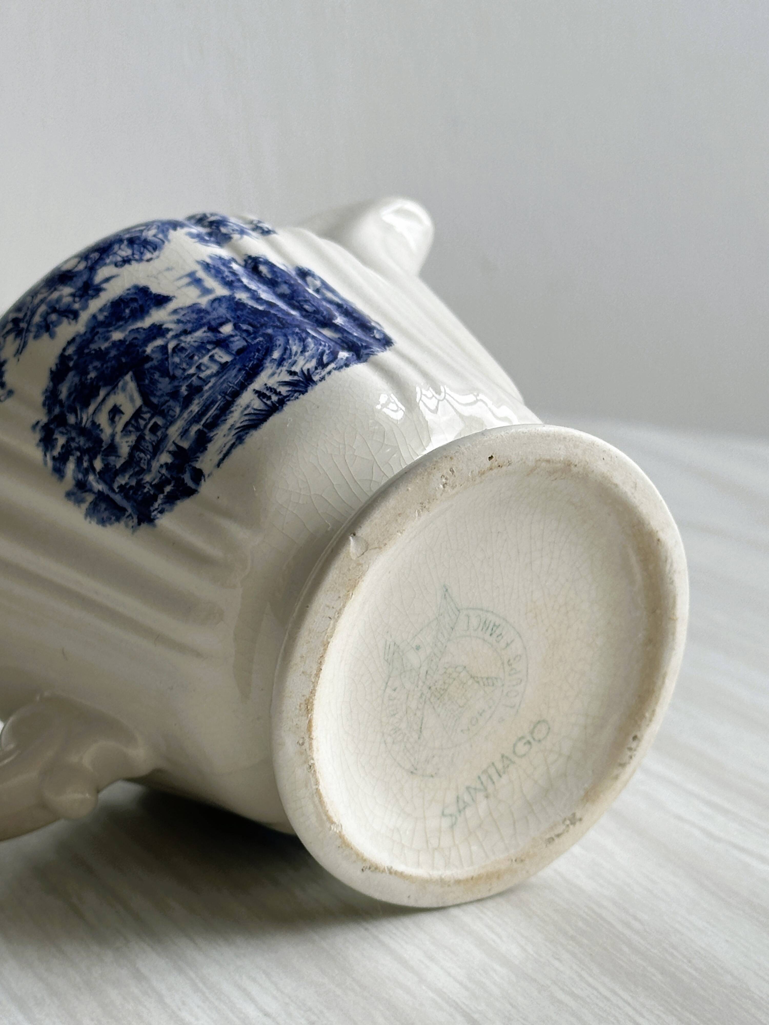 Porcelain sauce boat with blue pastoral pattern