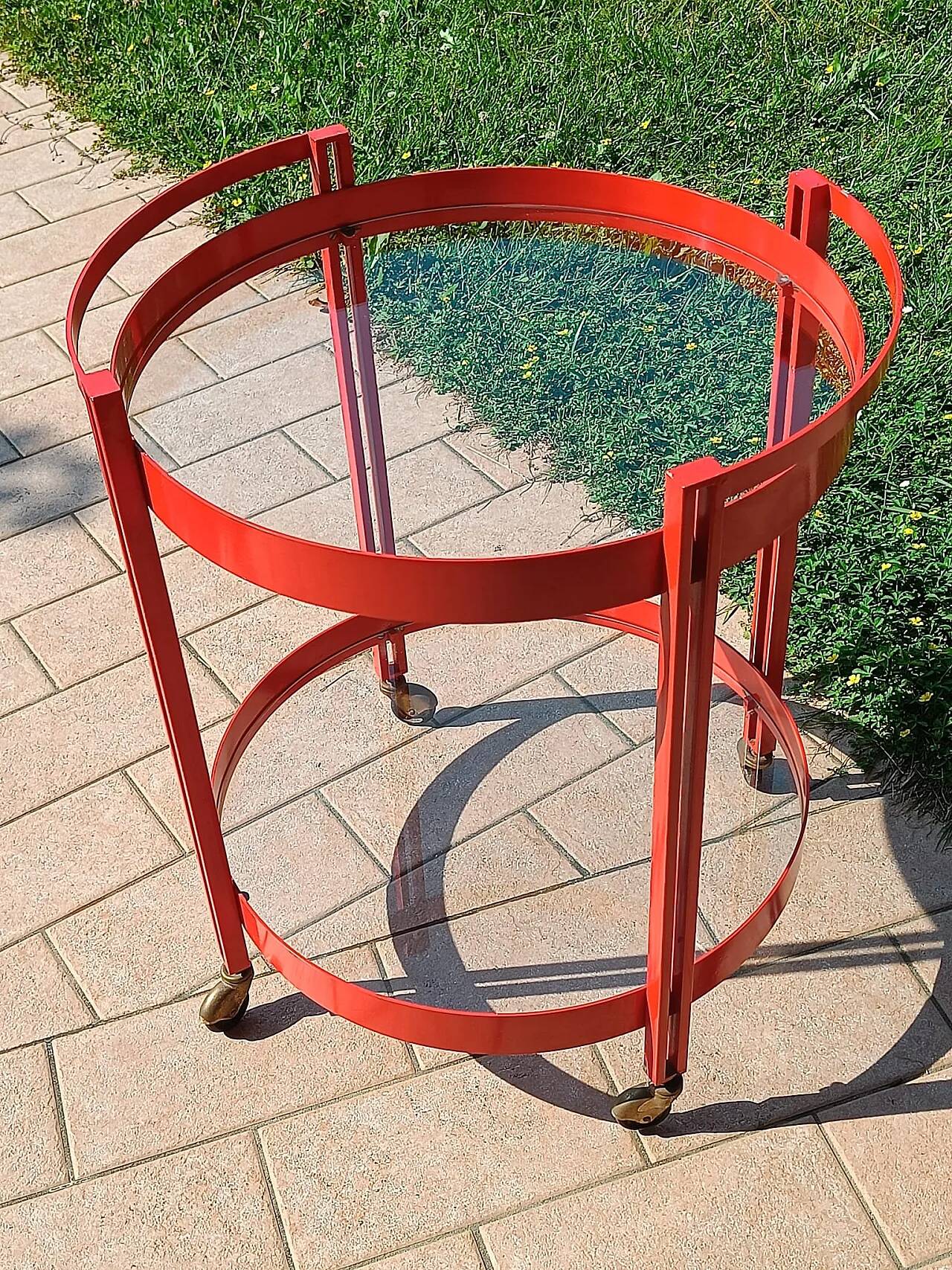 1970s bar trolley, red metal and double glass shelf.