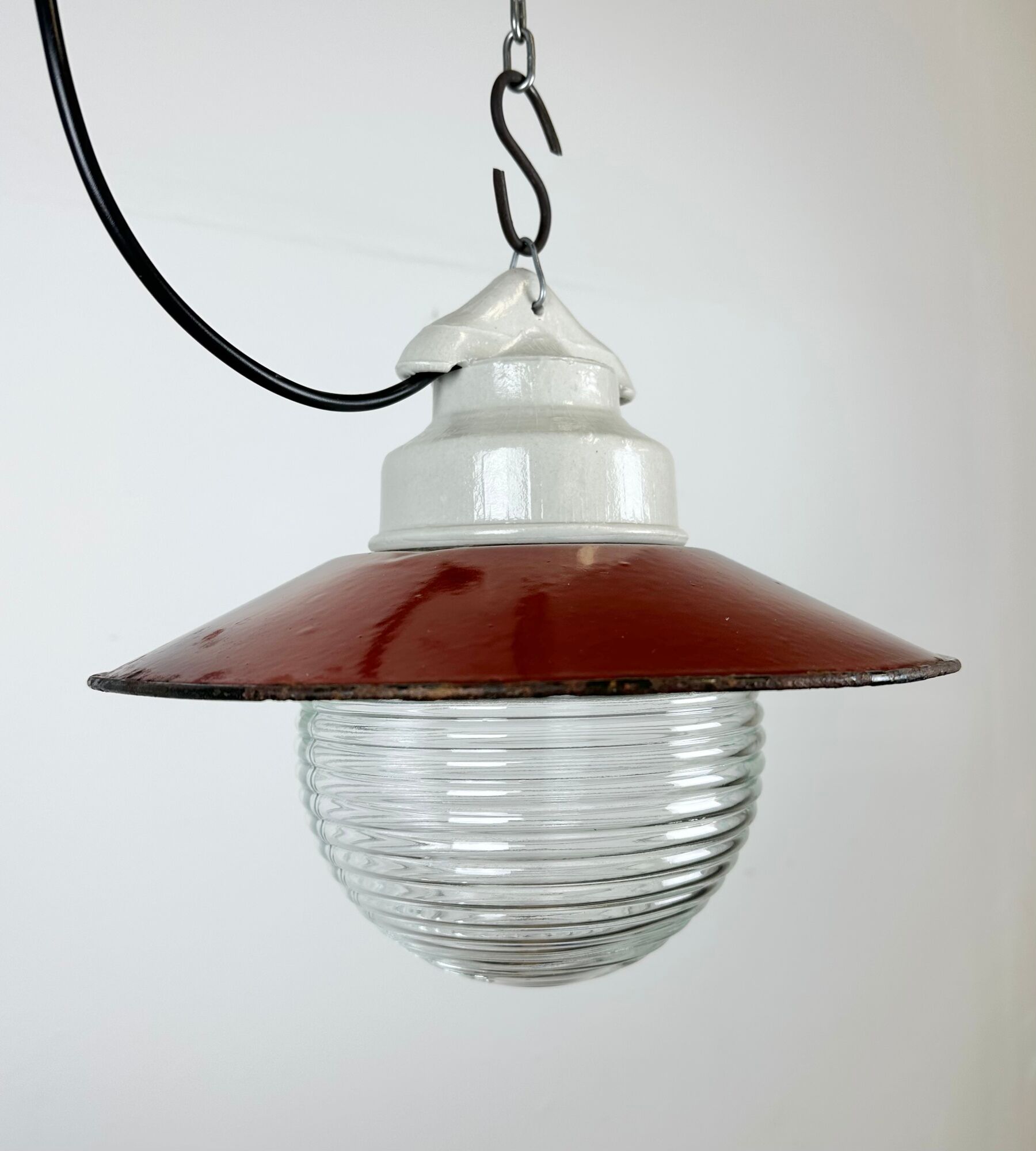Industrial porcelain red enamel pendant light with ribbed clear glass, 1970s