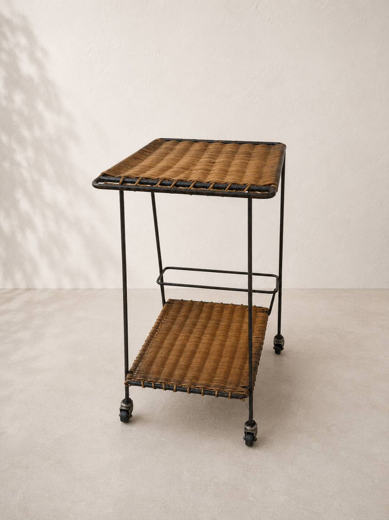 Vintage rolling dessert trolley in rattan and black metal – 1950s/60s