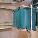 4 vintage Italian armchairs in green leather and chrome metal.