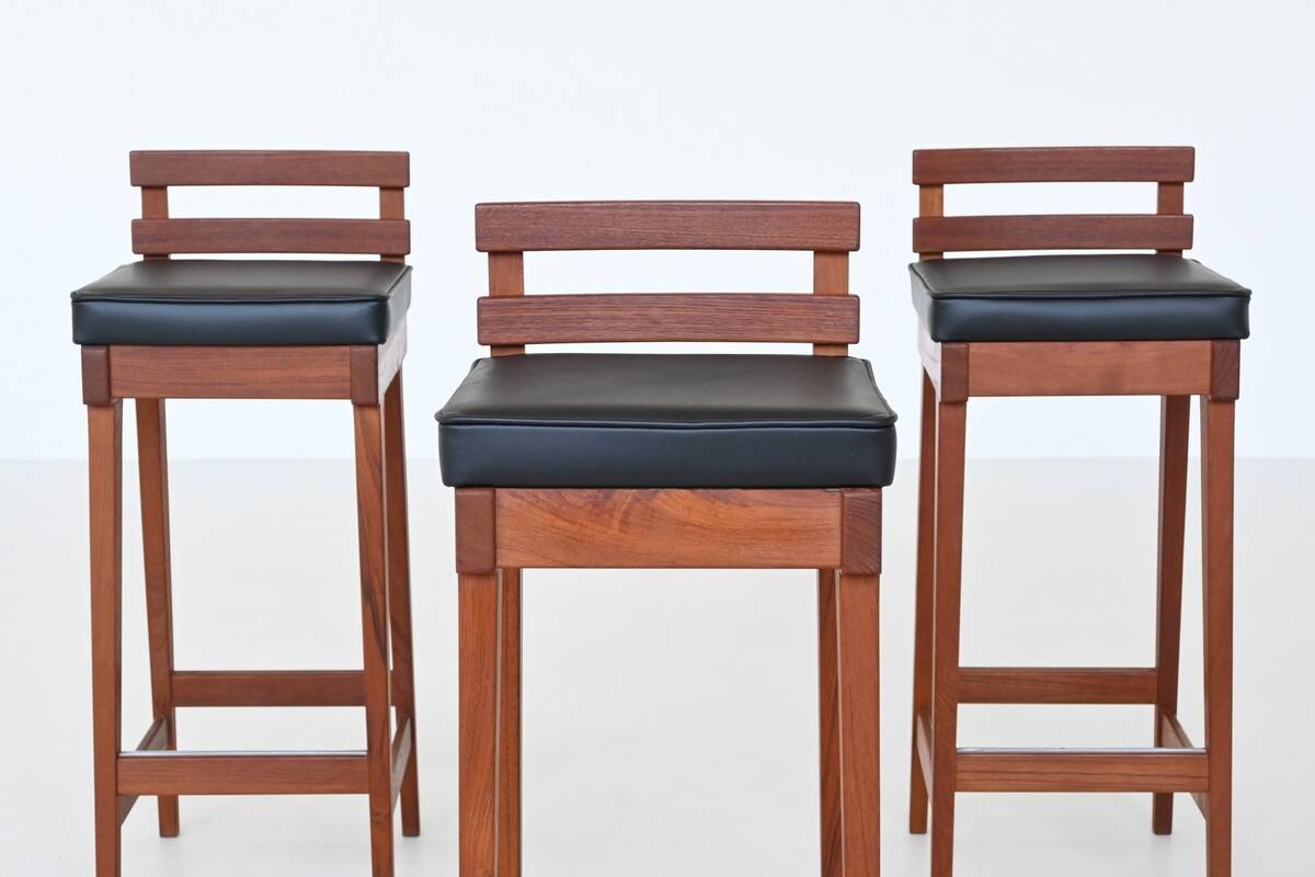 Erik Buck set of three bar stools in teak and leather Dyrlund Denmark 1960